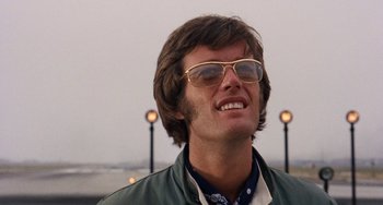 Movie still from “Easy Rider” (1969), directed by Dennis Hopper – A person wearing sunglasses and a jacket; Close Up shot, Low angle
