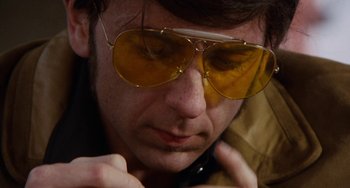 Movie still from “Easy Rider” (1969), directed by Dennis Hopper – A person wearing a pair of sunglasses; Close Up shot, Low angle