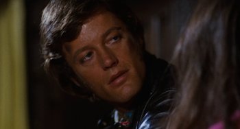 Movie still from “Easy Rider” (1969), directed by Dennis Hopper – A person wearing a leather jacket; Close Up shot, Over the shoulder angle