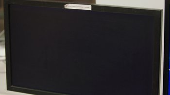 Movie still from “Free Solo” (2018), directed by Elizabeth Chai Vasarhelyi – A black television screen with a white label on it; Extreme Close Up shot, High angle