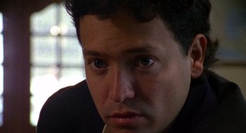 Movie still from “El Mariachi” (1992), directed by Robert Rodriguez – A man's face with green eyes; Close Up shot, High angle