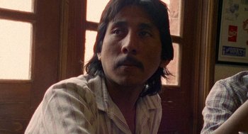 Movie still from “El Mariachi” (1992), directed by Robert Rodriguez – A person with long hair; Close Up shot, Low angle