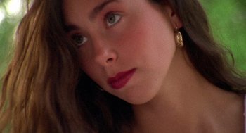 Movie still from “El Mariachi” (1992), directed by Robert Rodriguez – A woman's face with red lipstick; Close Up shot, High angle