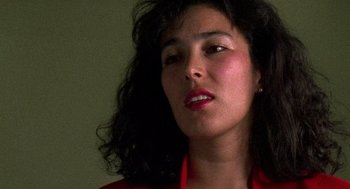 Movie still from “El Mariachi” (1992), directed by Robert Rodriguez – A person wearing a red shirt; Close Up shot, Low angle