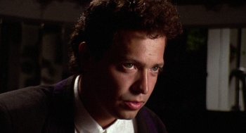 Movie still from “El Mariachi” (1992), directed by Robert Rodriguez – A person wearing a suit and tie; Close Up shot, Low angle