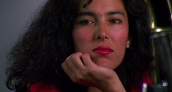 Movie still from “El Mariachi” (1992), directed by Robert Rodriguez – A person wearing a red shirt; Close Up shot, High angle