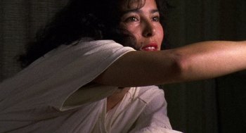 Movie still from “El Mariachi” (1992), directed by Robert Rodriguez – A person holding something in their hand; Close Up shot, Low angle