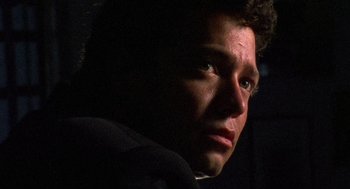 Movie still from “El Mariachi” (1992), directed by Robert Rodriguez – A man's face in the dark; Extreme Close Up shot, Low angle