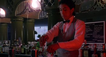 Movie still from “El Mariachi” (1992), directed by Robert Rodriguez – A man in a white shirt and a black bow tie; Medium shot, Low angle