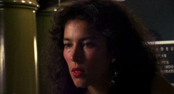 Movie still from “El Mariachi” (1992), directed by Robert Rodriguez – A person with long curly hair; Close Up shot, Low angle