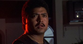 Movie still from “El Mariachi” (1992), directed by Robert Rodriguez – A person with a beard and mustache; Close Up shot, Low angle