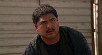 Movie still from “El Mariachi” (1992), directed by Robert Rodriguez – A person with a beard and mustache; Close Up shot, Low angle