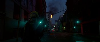 Movie still from “Ema” (2019), directed by Pablo Larraín – A city street at night lit up by street lights; Extreme Wide shot, Low angle