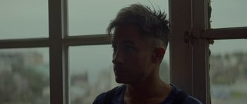 Movie still from “Ema” (2019), directed by Pablo Larraín – A person with a hair cut; Close Up shot, Over the shoulder angle