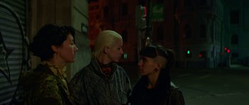 Movie still from “Ema” (2019), directed by Pablo Larraín – A couple of women standing next to each other on a street; Close Up shot, Over the shoulder angle