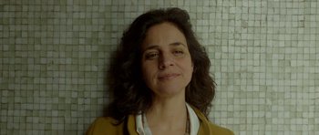 Movie still from “Ema” (2019), directed by Pablo Larraín – A person with long dark hair; Close Up shot, Low angle