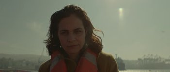 Movie still from “Ema” (2019), directed by Pablo Larraín – A person wearing a life jacket; Close Up shot, Low angle