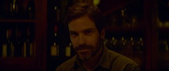 Movie still from “Ema” (2019), directed by Pablo Larraín – A person with a beard; Close Up shot, Over the shoulder angle