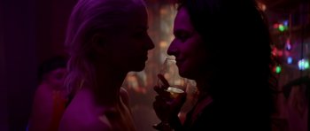 Movie still from “Ema” (2019), directed by Pablo Larraín – A man and a woman holding a wine glass; Close Up shot, Over the shoulder angle