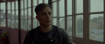 Movie still from “Ema” (2019), directed by Pablo Larraín – A person with a beard; Close Up shot, Low angle