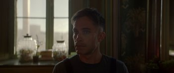 Movie still from “Ema” (2019), directed by Pablo Larraín – A person looking at the camera; Close Up shot, Over the shoulder angle