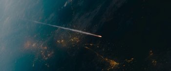 Movie still from “Encounter” (2021), directed by Michael Pearce – An airplane flying in the sky at night; Extreme Wide shot, High angle