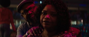 Movie still from “Encounter” (2021), directed by Michael Pearce – A man and a woman are posing for a picture; Close Up shot, Over the shoulder angle