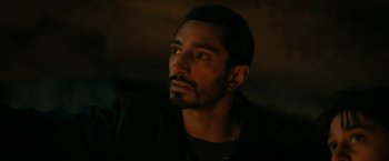 Movie still from “Encounter” (2021), directed by Michael Pearce – A person with a beard; Close Up shot, Over the shoulder angle