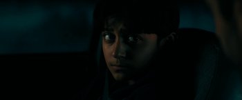 Movie still from “Encounter” (2021), directed by Michael Pearce – A young boy is looking into the camera; Close Up shot, High angle