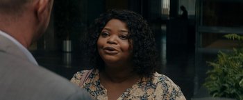 Movie still from “Encounter” (2021), directed by Michael Pearce – A person wearing a floral shirt; Close Up shot, Over the shoulder angle