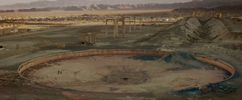 Movie still from “Encounter” (2021), directed by Michael Pearce – An empty pool in the middle of an empty field; Extreme Wide shot, High angle