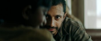 Movie still from “Encounter” (2021), directed by Michael Pearce – A person looking at the camera; Close Up shot, Over the shoulder angle