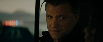 Movie still from “Encounter” (2021), directed by Michael Pearce – A person wearing a black jacket; Close Up shot, Over the shoulder angle