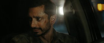 Movie still from “Encounter” (2021), directed by Michael Pearce – A person with a bruise on his face; Close Up shot, Over the shoulder angle