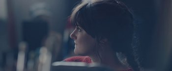 Movie still from “Endings, Beginnings” (2019), directed by Drake Doremus – A person sitting in a chair; Close Up shot, Over the shoulder angle