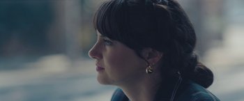 Movie still from “Endings, Beginnings” (2019), directed by Drake Doremus – A person wearing a earring; Close Up shot, Over the shoulder angle