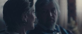 Movie still from “Endings, Beginnings” (2019), directed by Drake Doremus – A man and a woman sitting next to each other in a room; Close Up shot, Over the shoulder angle