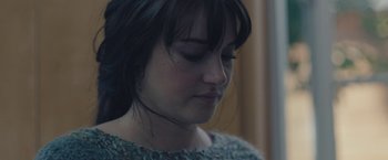 Movie still from “Endings, Beginnings” (2019), directed by Drake Doremus – A person with her eyes closed; Close Up shot, Overhead angle