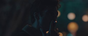 Movie still from “Endings, Beginnings” (2019), directed by Drake Doremus – A man is lighting a cigarette in the dark; Extreme Close Up shot, Over the shoulder angle