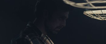 Movie still from “Endings, Beginnings” (2019), directed by Drake Doremus – A person wearing a hat; Close Up shot, Over the shoulder angle