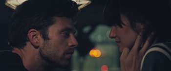 Movie still from “Endings, Beginnings” (2019), directed by Drake Doremus – A man and a woman face to face in the dark; Close Up shot, Over the shoulder angle