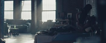 Movie still from “Endings, Beginnings” (2019), directed by Drake Doremus – A bed in a room that has a window in the background; Wide shot, High angle