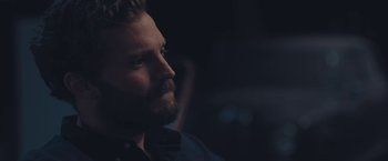 Movie still from “Endings, Beginnings” (2019), directed by Drake Doremus – A person with a beard looking to the side; Close Up shot, Over the shoulder angle