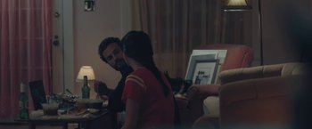 Movie still from “Endings, Beginnings” (2019), directed by Drake Doremus – A man and a woman sitting at a table talking to each other; Medium shot, Over the shoulder angle
