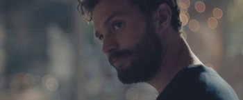 Movie still from “Endings, Beginnings” (2019), directed by Drake Doremus – A person with a beard; Close Up shot, Over the shoulder angle