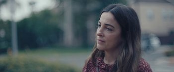 Movie still from “Endings, Beginnings” (2019), directed by Drake Doremus – A person looking at something; Close Up shot, Over the shoulder angle