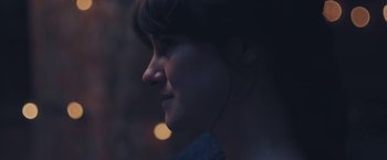 Movie still from “Endings, Beginnings” (2019), directed by Drake Doremus – A person wearing a headset; Extreme Close Up shot, Over the shoulder angle