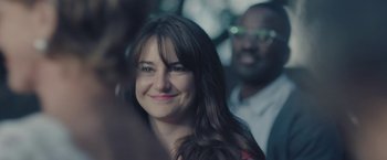 Movie still from “Endings, Beginnings” (2019), directed by Drake Doremus – A person smiling; Close Up shot, Over the shoulder angle