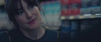 Movie still from “Endings, Beginnings” (2019), directed by Drake Doremus – A woman's face in a store; Close Up shot, Over the shoulder angle