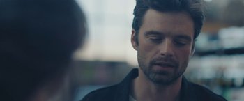 Movie still from “Endings, Beginnings” (2019), directed by Drake Doremus – A person wearing a black shirt; Close Up shot, Over the shoulder angle